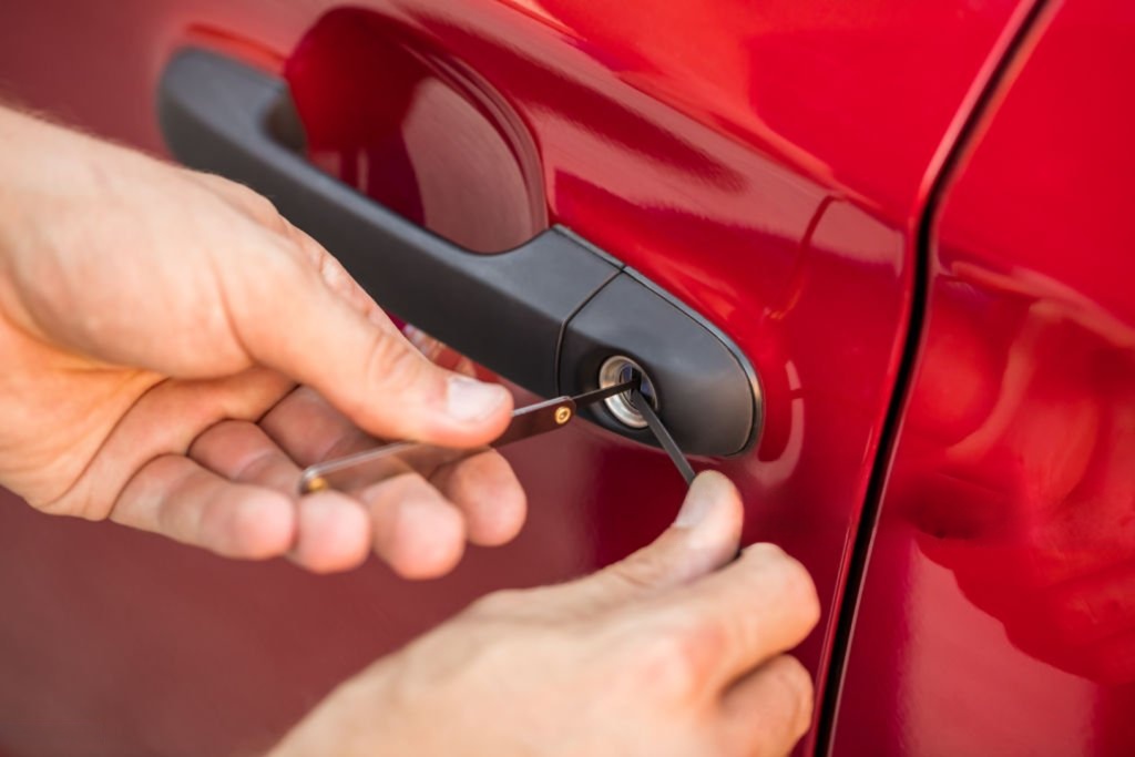 Technician picking car door lock