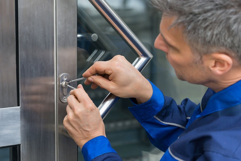 Locksmith picking a front door lock